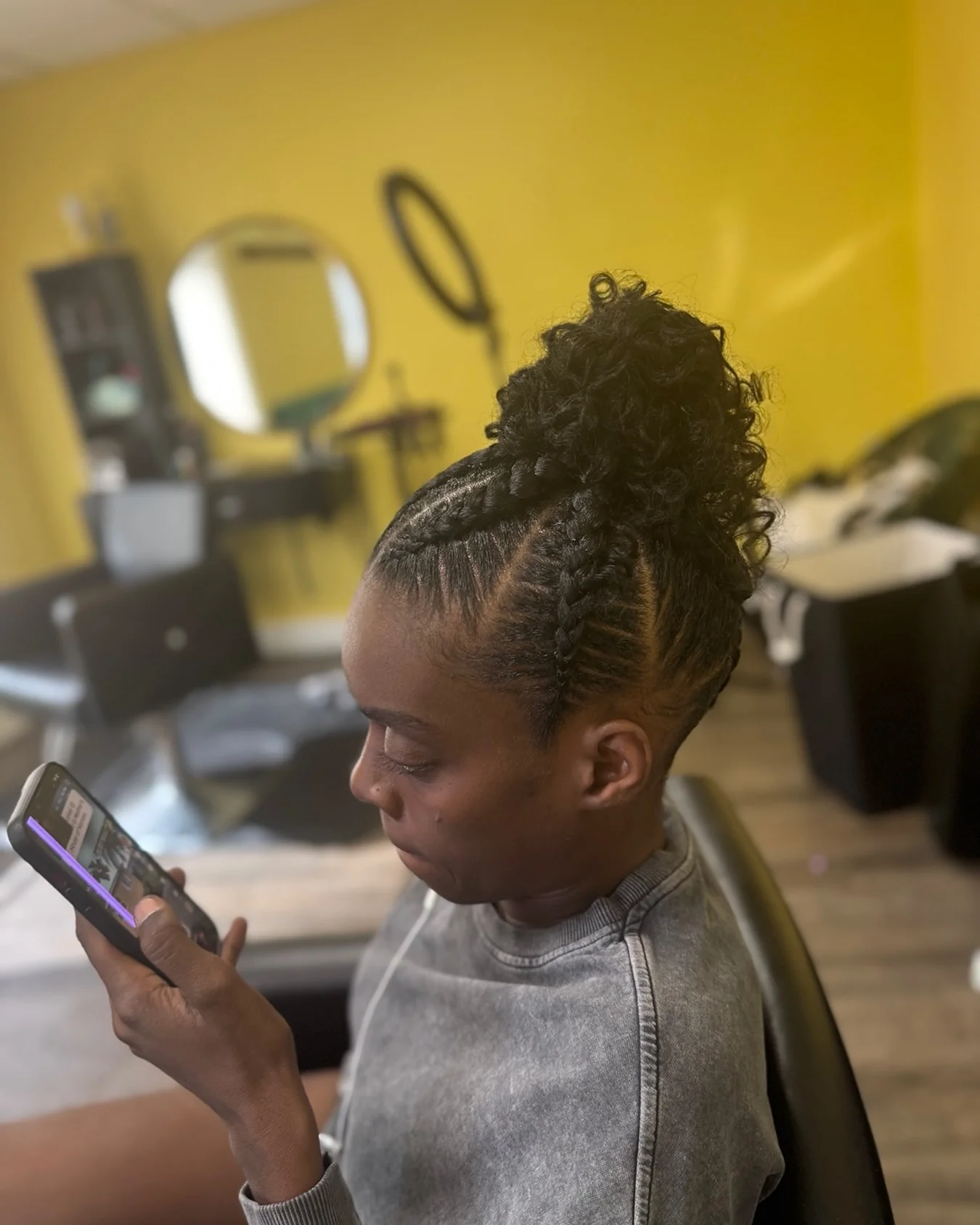 Stitch cornrow voluminous curly bun