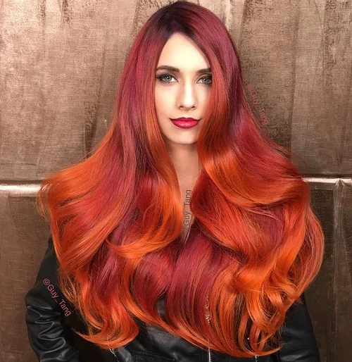 Burgundy and orange balayage mermaid hair with volume