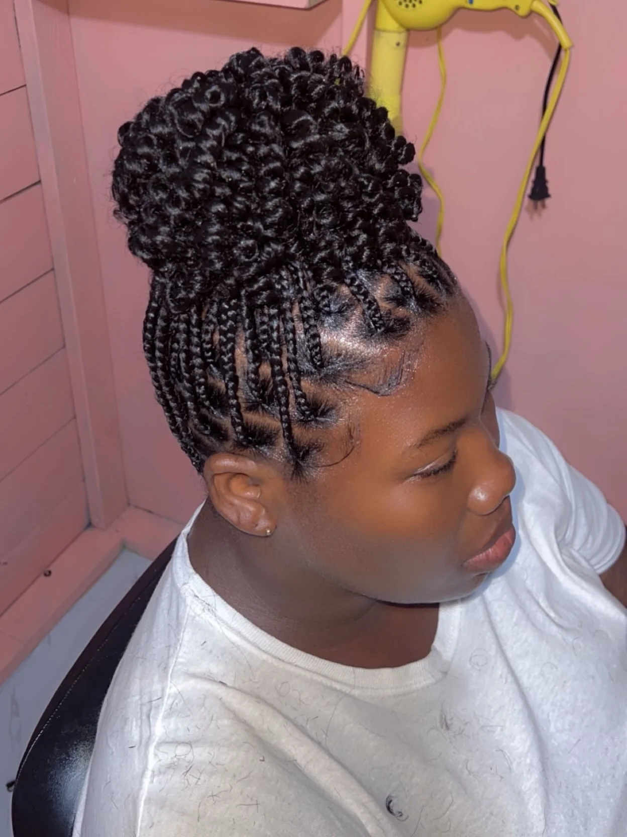 Tight curl cornrow high bun