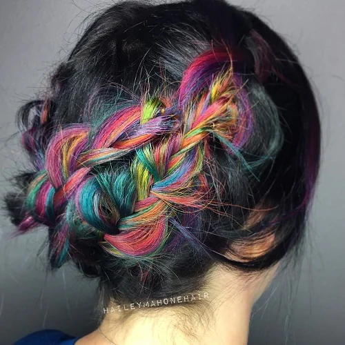 Black hair with rainbow highlights in a braid