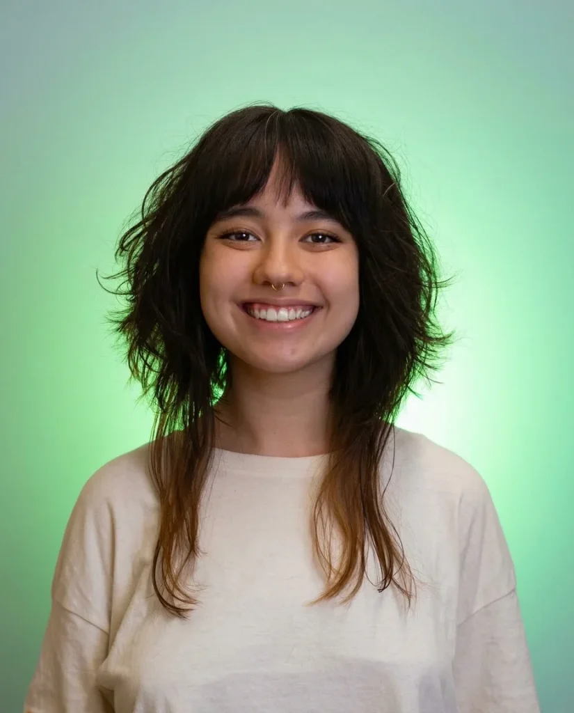 Jellyfish haircut with wispy bangs and long thin lower strands with caramel ends