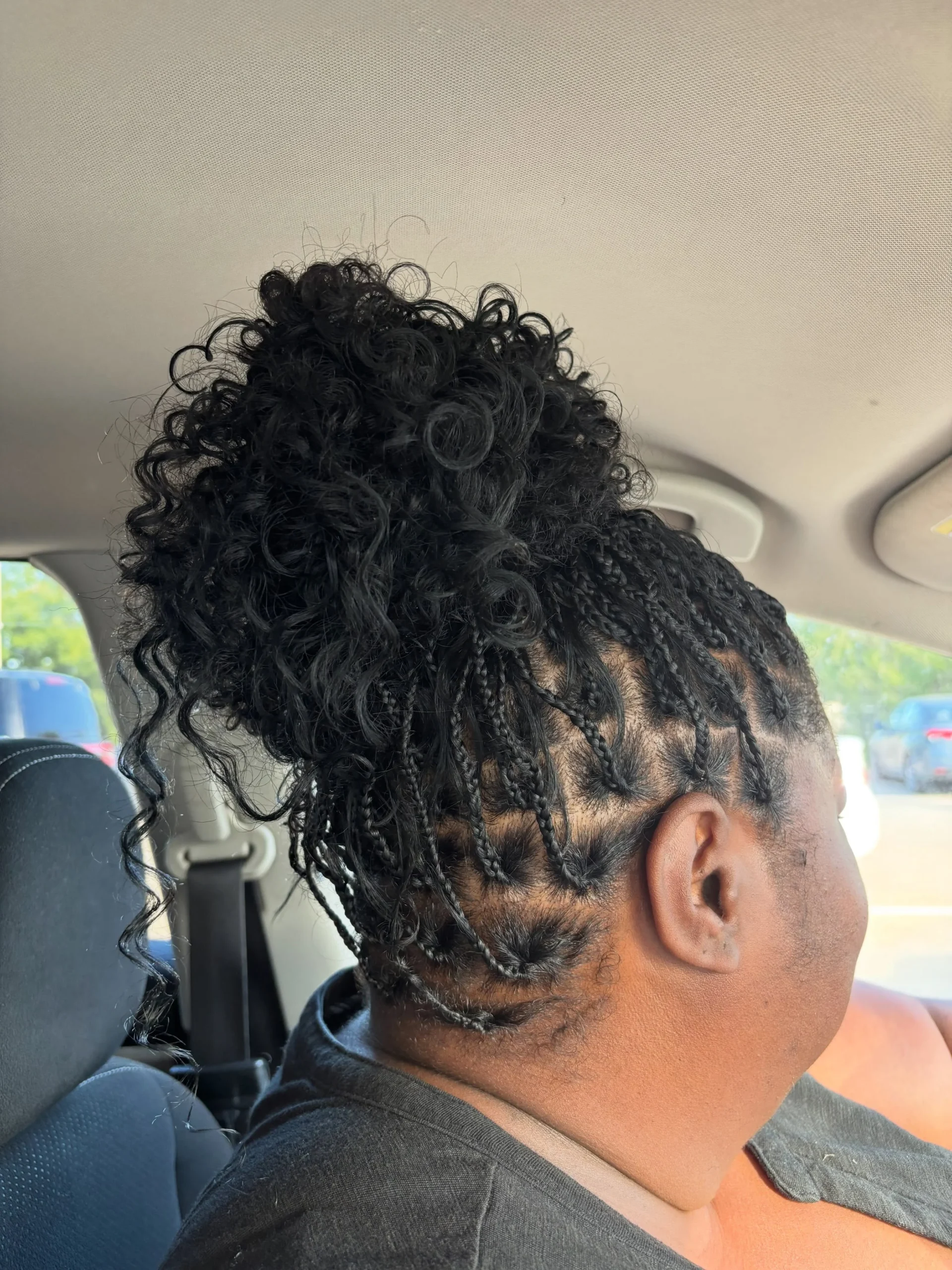 Small box braids with a loose spiral bun