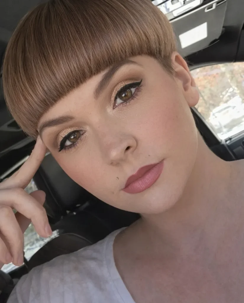 Modern bowl cut with blunt fringe in golden brown