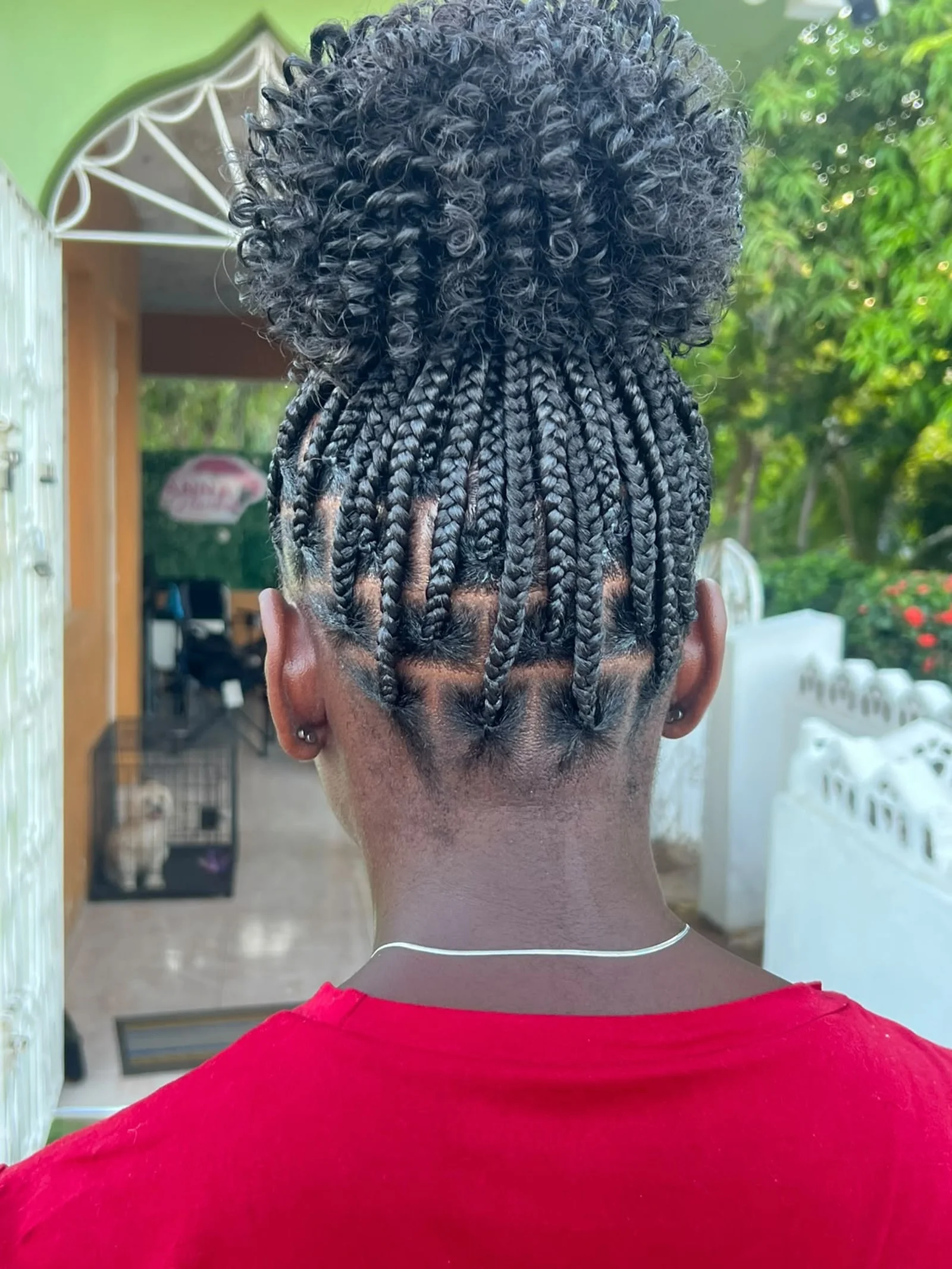Medium knotless braids with a tight curl bun