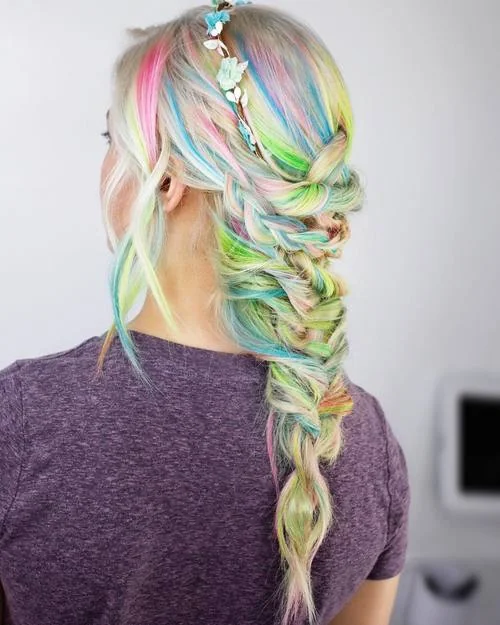 Blonde hair with rainbow highlights in a platinum braid