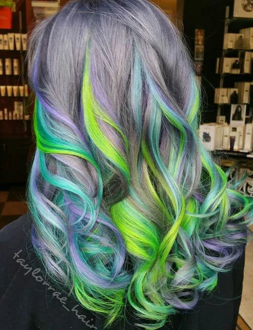 Pastel purple hair with blue and green neon highlights