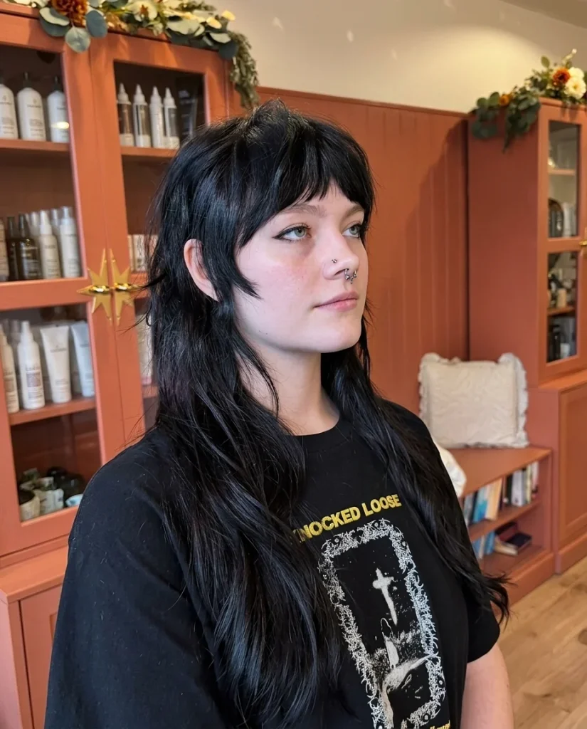  Long black shullet haircut with short choppy bangs