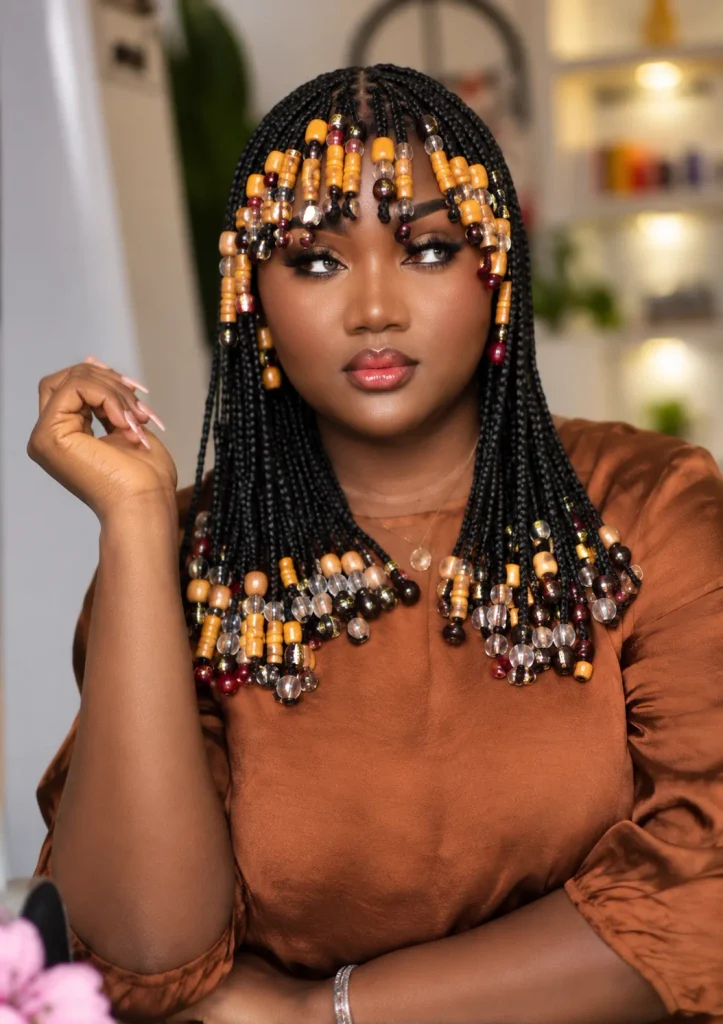 Bob-length braids with beaded bangs in amber, clear and burgundy beads