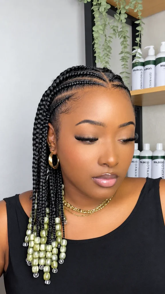 Half-up feed-in braids with olive green pearl beads on one side