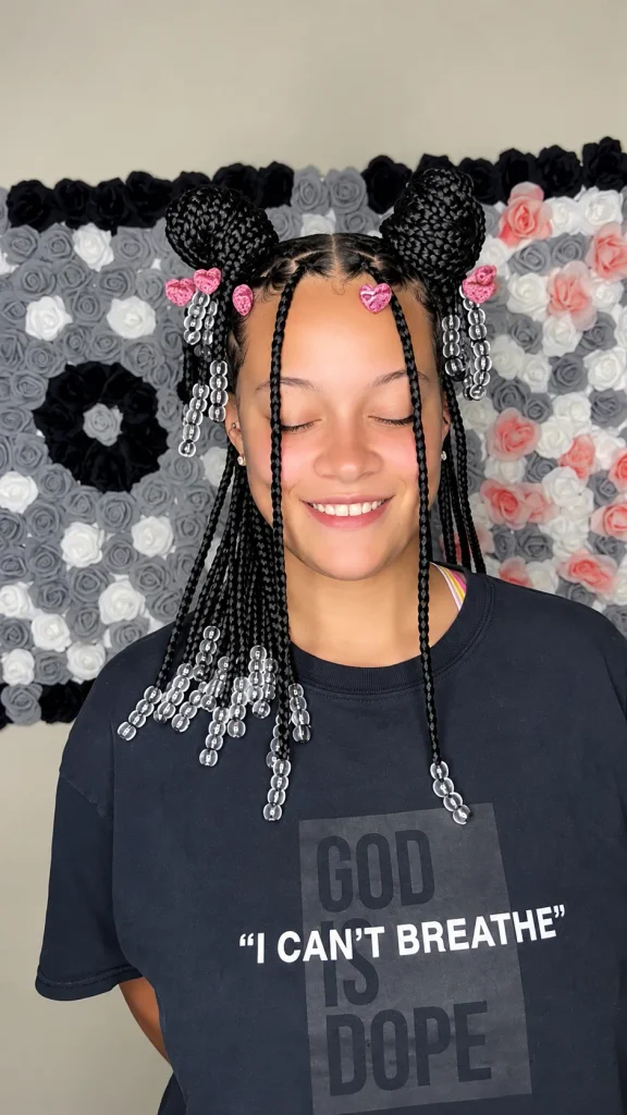 Space buns with box braids, clear beads and pink glitter heart clips