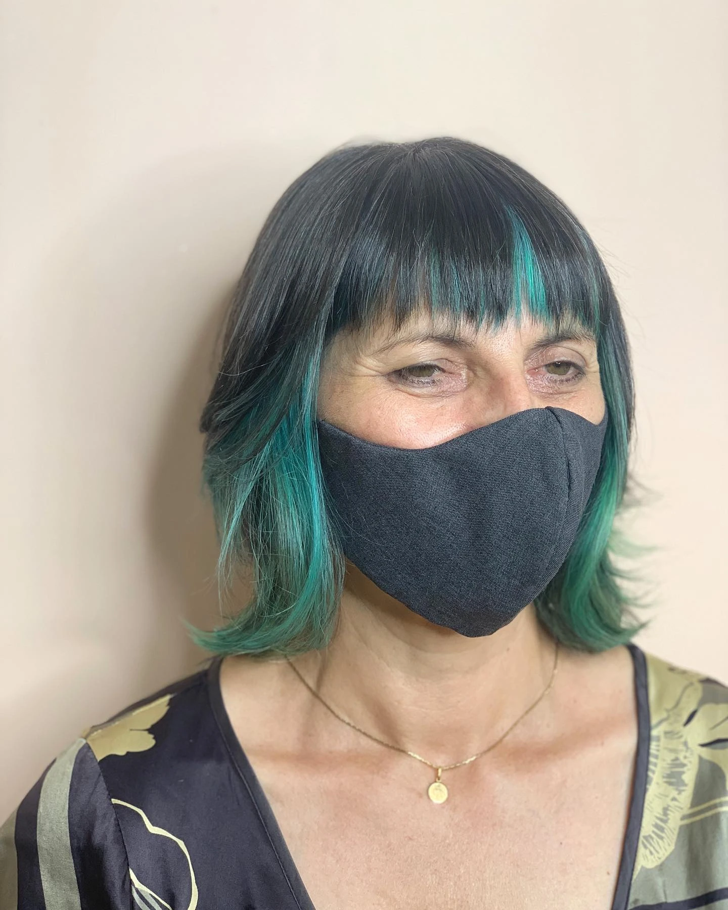 Bob with straight fringe, dark top and teal green underlayer