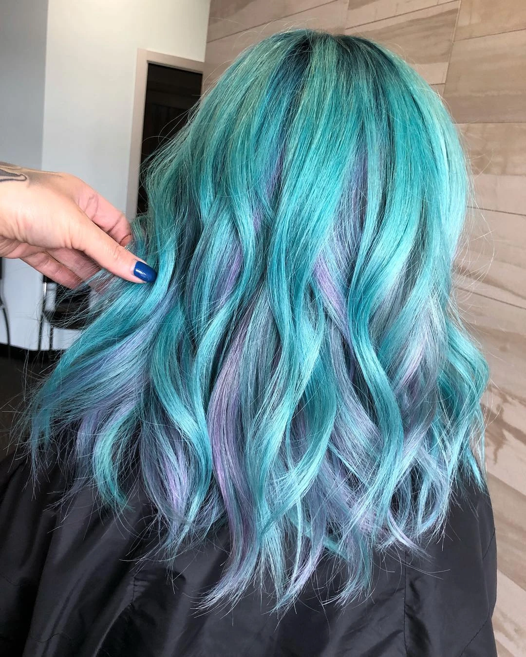 Long wavy teal hair with lavender streaks underneath