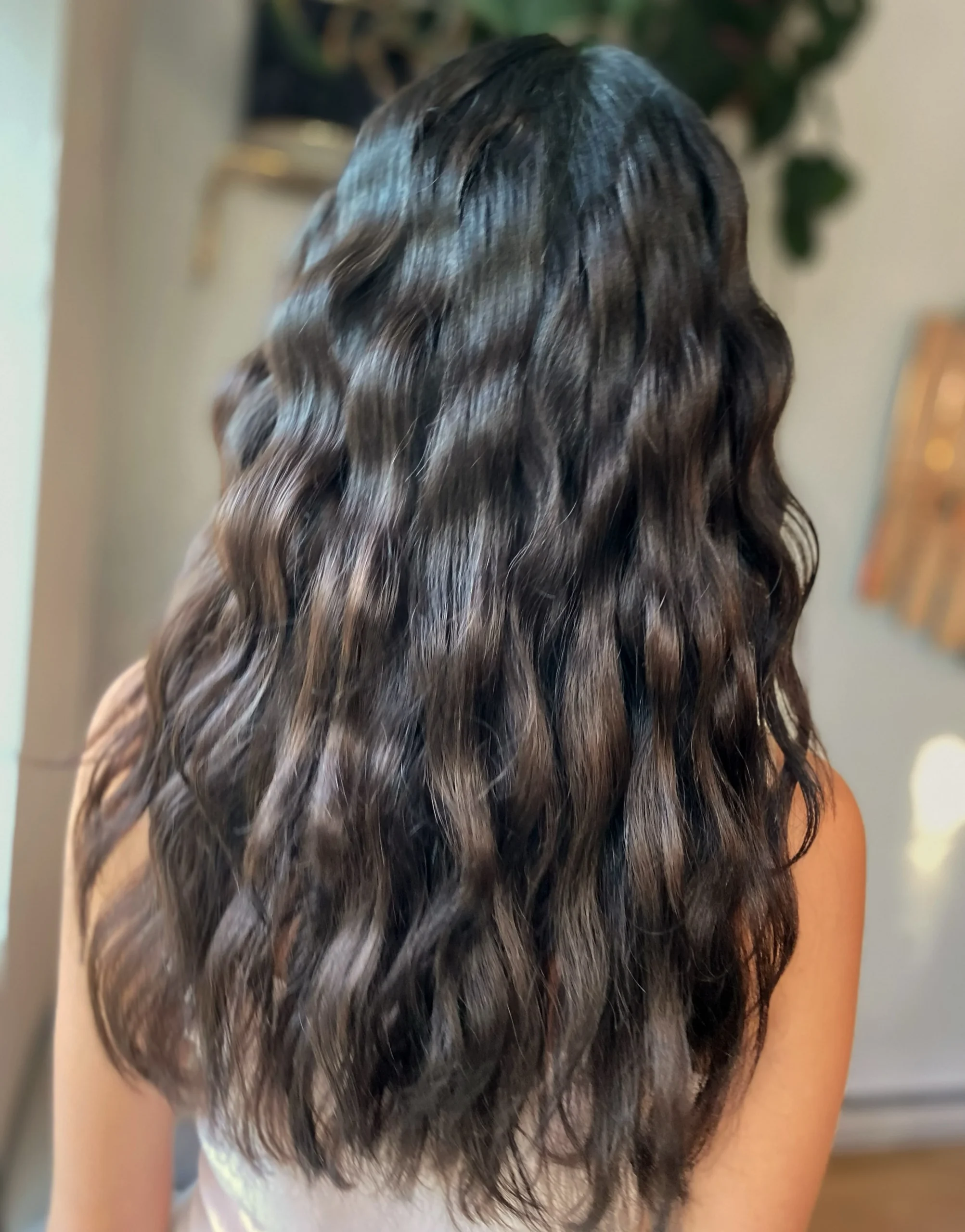 Long dark brown hair with soft defined crimp waves
