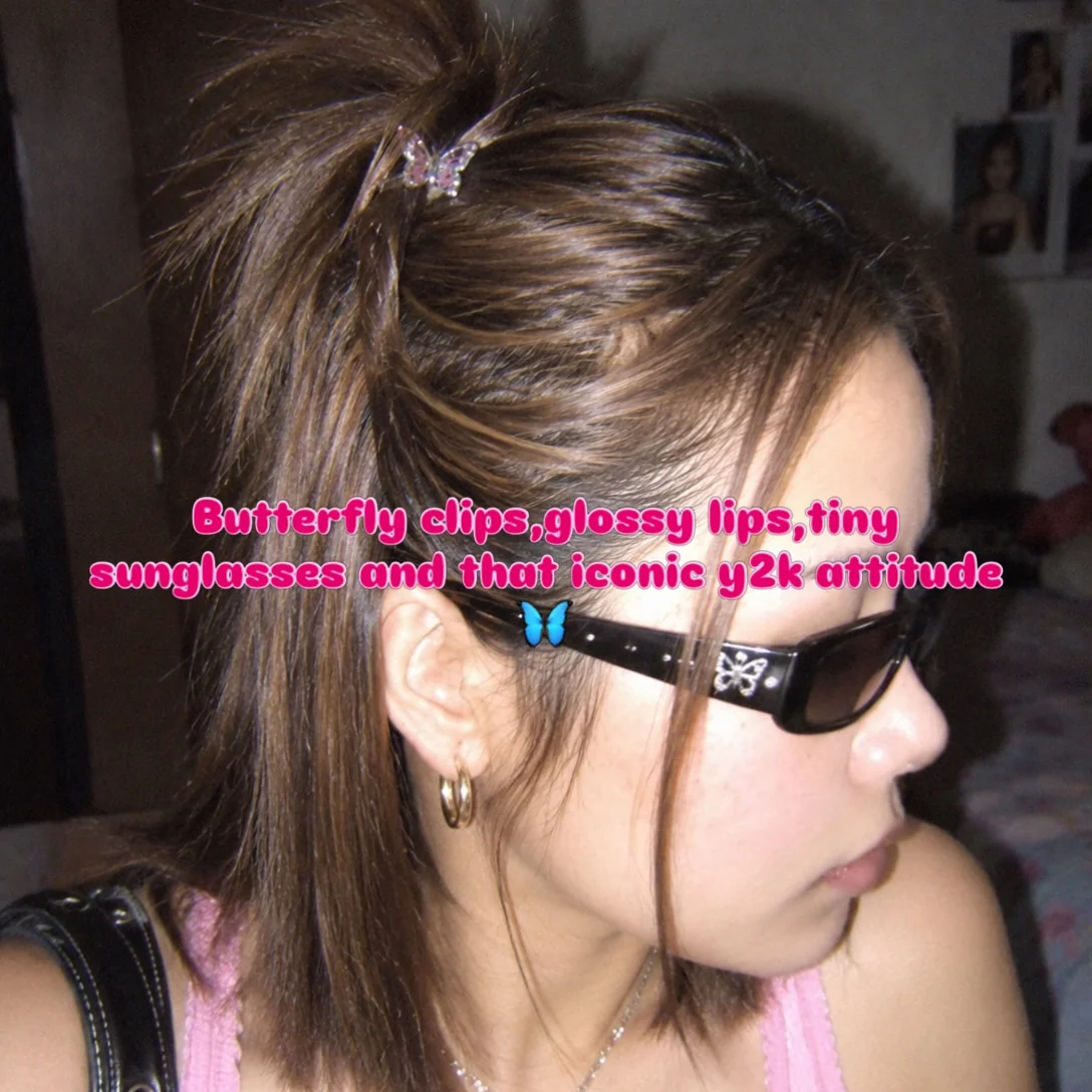 High ponytail with a pink butterfly clip and face framing strands